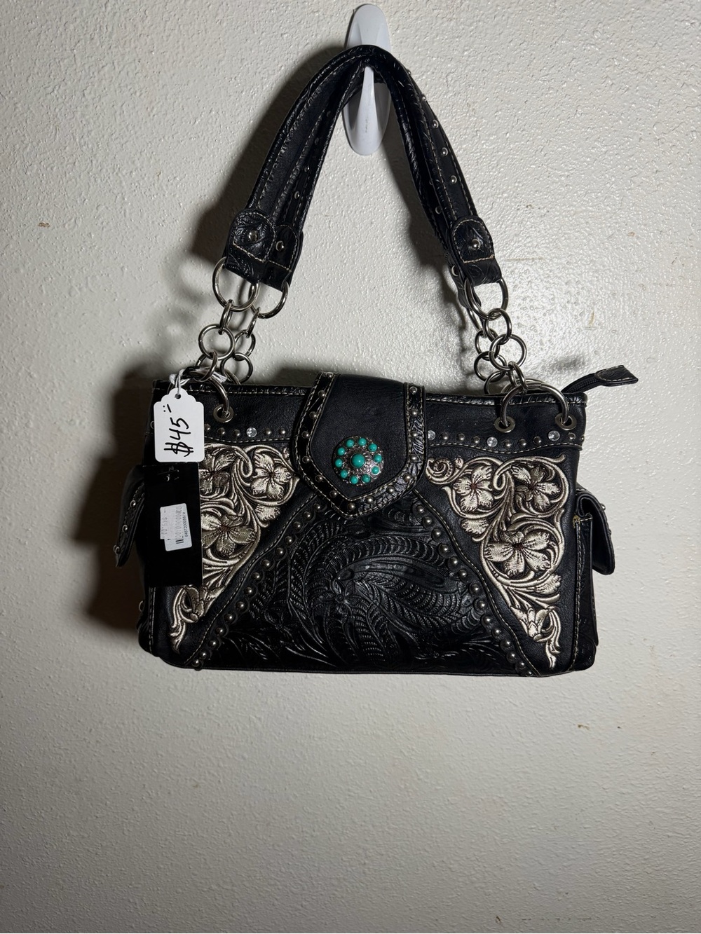 Black Embossed Shoulder Bag with Turquoise Accent and Silver Detailing